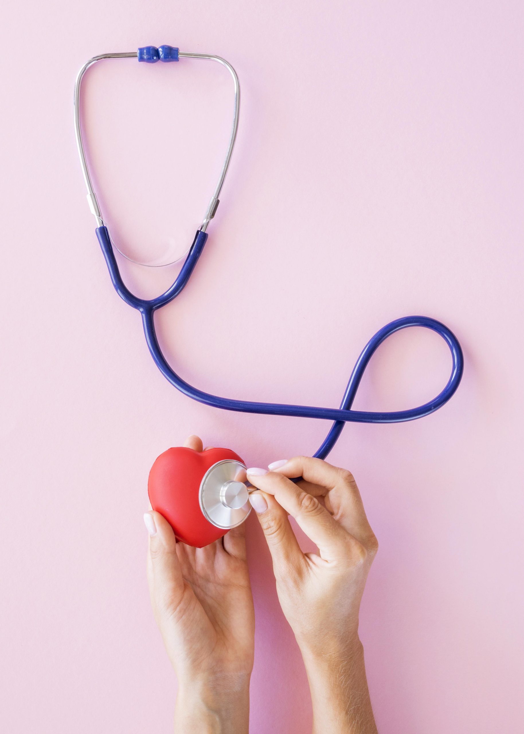 top-view-hands-checking-heart-with-stethoscope